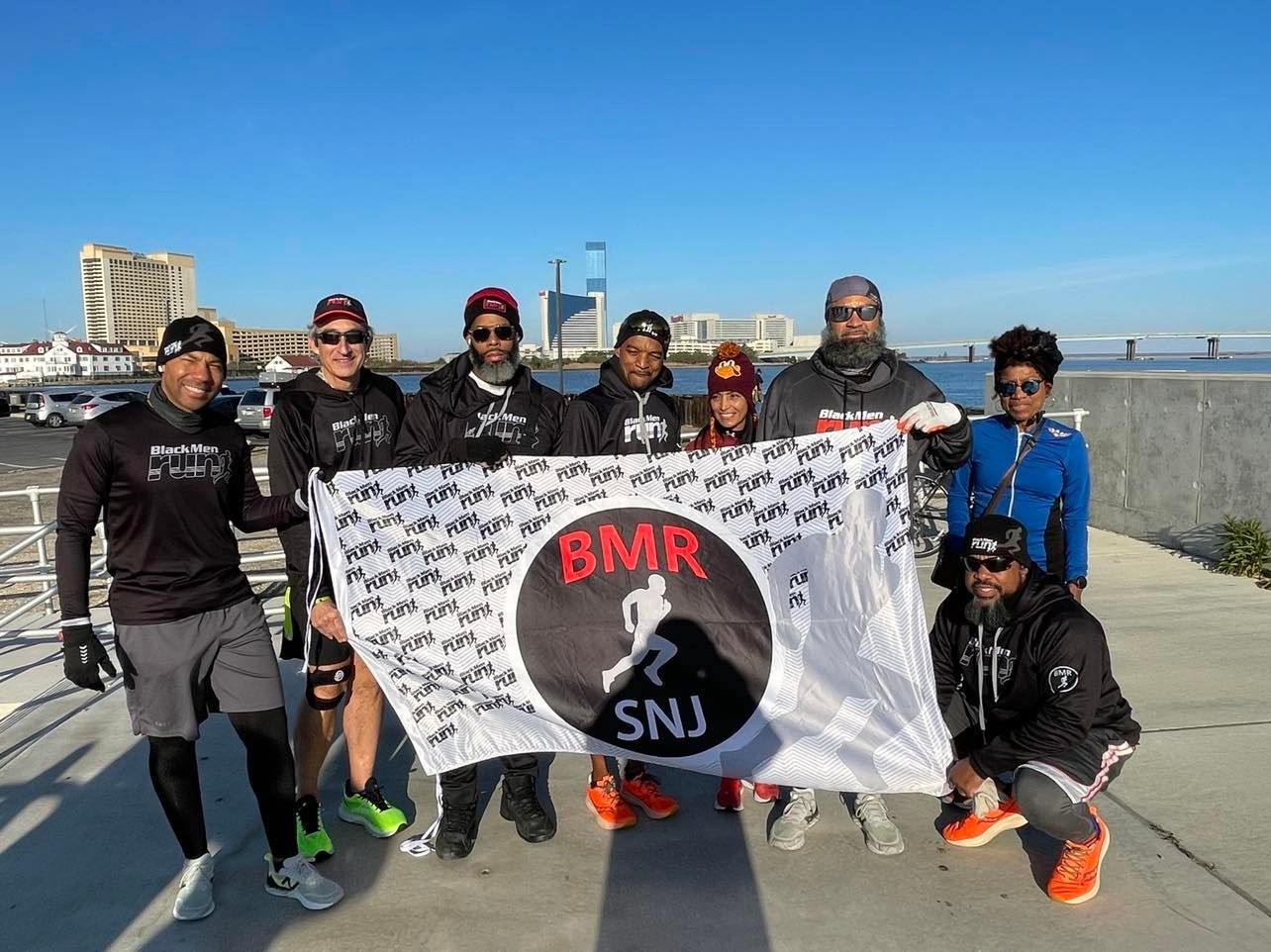 Black Men Run South New Jersey Chapter celebrate with Al Taliaferro as he takes his 1,000th run. Photo Credit: Mark Tyler