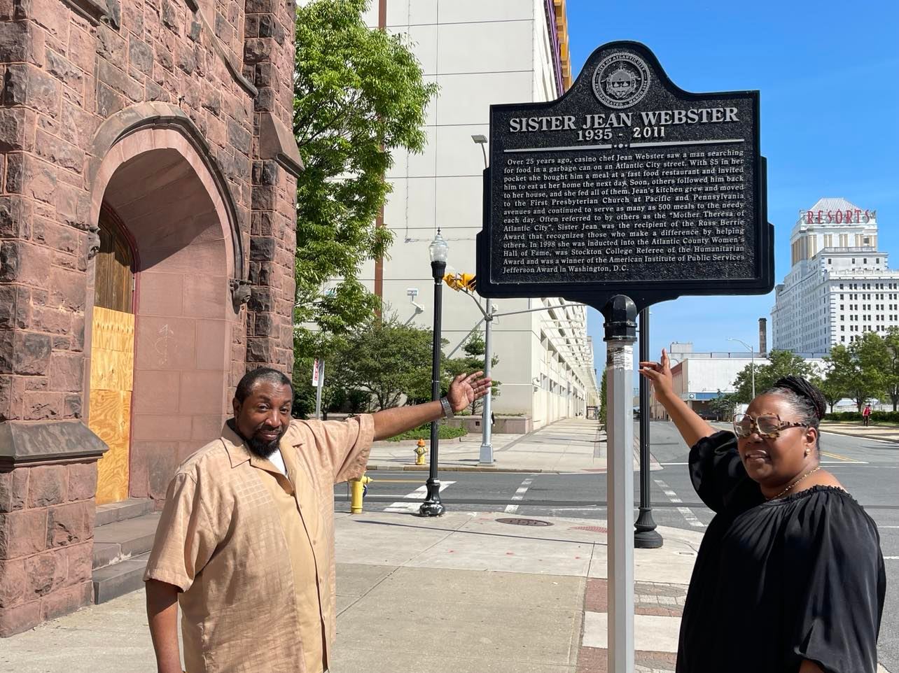 Bishop Charles Lyles and Lonniyell also known as "The Community" stand in front of marker celebrating Jean Webster who at one time fed more than 600 people per day at the Victory First Presbyterian Deliverance Church. Photo credit: Mark Tyler