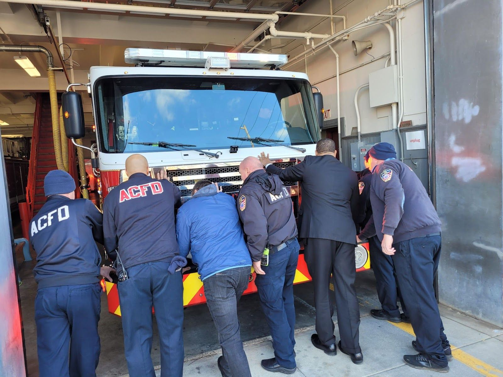 Mayor Marty Small Sr. and members of the Atlantic City Fire Department push Engine 3 into Station 3 located at Indiana and Grant avenues. Image Source: City of Atlantic City