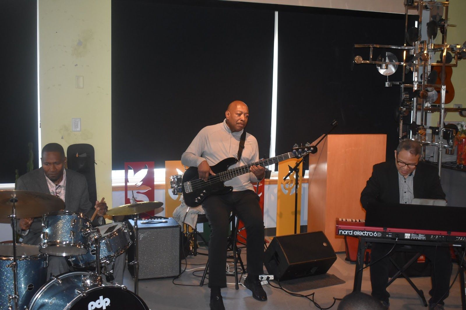 Take The A Train! Tony Day (on drums) and his trio perform the Duke Ellington classic "Take The A Train" at the Noyes Arts Garage during the book signing. Photo Credit: Raymond Tyler